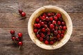 Sweet cherry with leaves in wooden bowl. Fresh ripe cherries. Cherry fruit Royalty Free Stock Photo