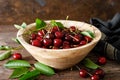 Sweet cherry with leaves in wooden bowl. Fresh ripe cherries. Cherry fruit Royalty Free Stock Photo