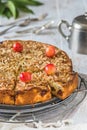 Sweet cherry pie with roasted almonds, on a white wooden table Royalty Free Stock Photo