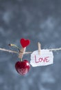 Sweet cherry and shred of paper with a word love on a rope Royalty Free Stock Photo