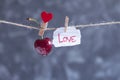 Sweet cherry and shred of paper with a word love on a rope Royalty Free Stock Photo