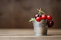 Sweet cherry in small decorative metal bucket on a wooden board Royalty Free Stock Photo