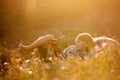 Sweet children, boys, playing in the park on sunset, autumn