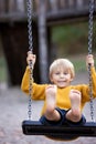 Sweet children, boys, playing in the park on sunset, autumn