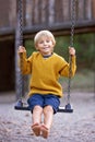 Sweet children, boys, playing in the park on sunset, autumn