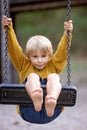 Sweet children, boys, playing in the park on sunset, autumn