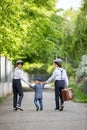 Sweet children in vintage clothing, holding suitcase, running in the park Royalty Free Stock Photo