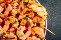 Sweet Chili Shrimp Skewers with lemon and parsley on gray stone background Royalty Free Stock Photo