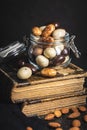 Sweet chocolate almonds. Chocolate eggs in jar Royalty Free Stock Photo