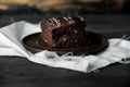 Sweet chocolate brownie with coffe cream on a dark, rustic, wooden table Royalty Free Stock Photo