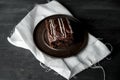 Sweet chocolate brownie with coffe cream on a dark, rustic, wooden table Royalty Free Stock Photo