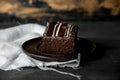 Sweet chocolate brownie with coffe cream on a dark, rustic, wooden table Royalty Free Stock Photo