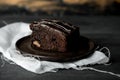 Sweet chocolate brownie with coffe cream on a dark, rustic, wooden table Royalty Free Stock Photo
