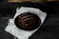 Sweet chocolate brownie with coffe cream on a dark, rustic, wooden table Royalty Free Stock Photo