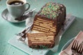 Sweet chocolate cake with biscuits and topping