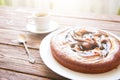 Sweet chocolate cake. Delicious chocolate cake in white plate with cup of coffee on wooden table background, close-up Royalty Free Stock Photo