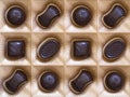 Sweet chocolate candies assortment in a box close-up. Top view