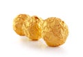 Sweet chocolate candy wrapped in golden foil Royalty Free Stock Photo