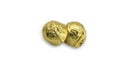 Sweet chocolate candy wrapped In golden foil papper on white background. Royalty Free Stock Photo