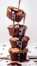 Sweet chocolate icing pouring over delicious naked cupcakes