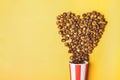 Sweet chocolate popcorn in paper striped white red cup Royalty Free Stock Photo