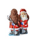 Sweet chocolate Santa Claus candies in foil wrappers on white background Royalty Free Stock Photo