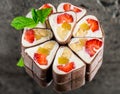 Sweet chocolate sushi roll with fruits Royalty Free Stock Photo