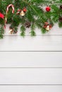 Christmas background with candies and fir tree border on wood Royalty Free Stock Photo