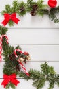 Christmas background with candies and fir tree border on wood Royalty Free Stock Photo