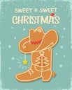 Sweet Christmas cowboy boot gingerbread cookie vintage card background with christmas text on old paper texture. Royalty Free Stock Photo