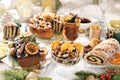 Sweet Christmas with traditional dessert and pastries on festive table Royalty Free Stock Photo