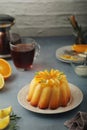 A sweet citrus cake served with oranges and lemons