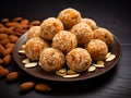 Sweet coconut murmura ladoo or nariyal laddu is a popular Indian festive dish. Served in a dark background