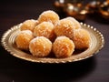 Sweet coconut murmura ladoo or nariyal laddu is a popular Indian festive dish. Served in a dark background