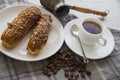 Sweet coffee and eclairs Royalty Free Stock Photo