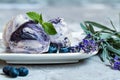 Sweet cold dessert, classic lavender ice cream with blueberry syrup