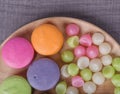 Sweet colorful cake macaron and Aalaw or Alua candy in plate on