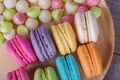 Sweet colorful cake macaron and Aalaw or Alua candy in plate on