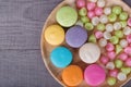 Sweet colorful cake macaron and Aalaw or Alua candy in plate on