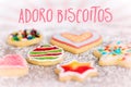 Sweet and colorful cookies on icing sugar background, spanish Te