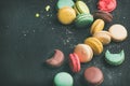 Sweet colorful French macaroon cookies variety with sugar powder