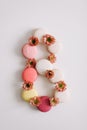 Figure eight from colorful french macaroons. March 8 concept, Women`s Day. copy space Royalty Free Stock Photo