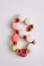 Figure eight from colorful french macaroons. March 8 concept, Women`s Day. copy space Royalty Free Stock Photo
