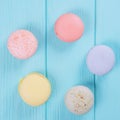 Sweet colorful macaroons on pastel blue background