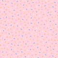 Sweet colorful sprinkling on a pink background.