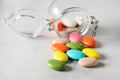 Sweet Colorfull Candy Dragee Glass Gar Mix of Colored Sweets Dragee Sweets Confectionery Gray Background