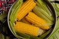 Sweet corn boil with salt. cooked sweet corn in pot on wooden table. Royalty Free Stock Photo