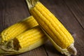 Sweet corn cooked on wooden background, ripe corn cobs steamed or boiled sweetcorn for food vegan dinner or snack Royalty Free Stock Photo