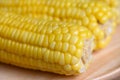 Sweet corn cooked on wooden plate background, close up ripe corn cobs steamed or boiled sweetcorn for food vegan dinner or snack Royalty Free Stock Photo