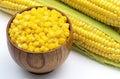 Sweet corn grains in wooden bowl. Royalty Free Stock Photo